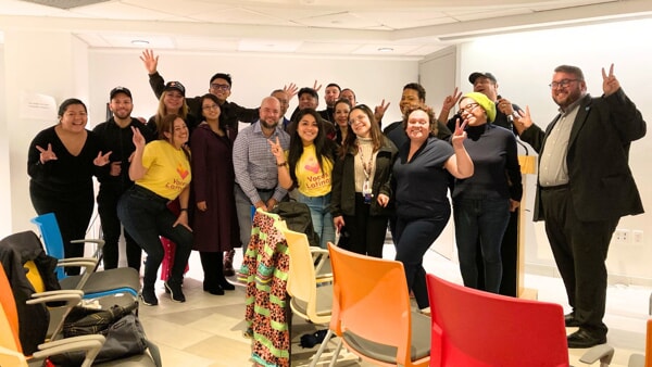 A group shot of Apicha team members, alongside representatives from Voces Latinas and the New York City Commission for Human Rights